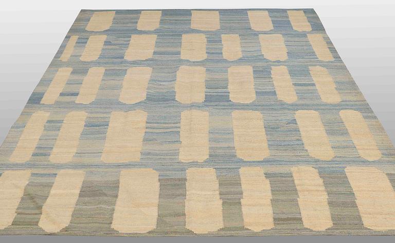 A flatweave rug, 285 x 222 cm.