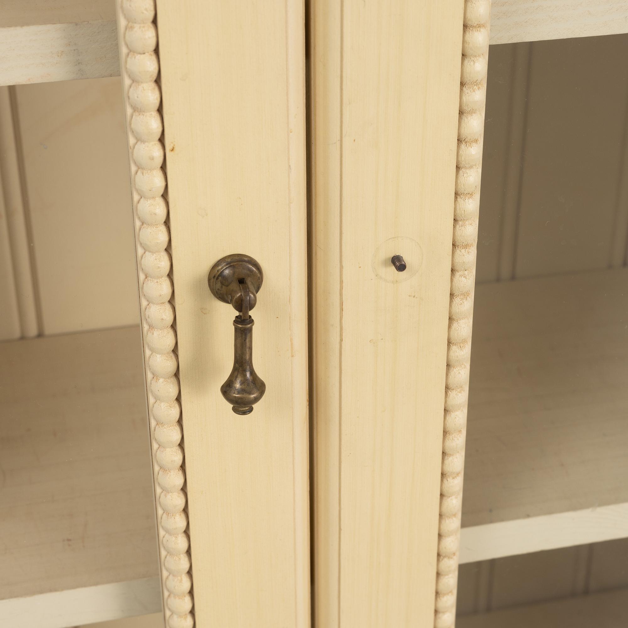 A pair of Gustavian style book cabinets, 21st century.