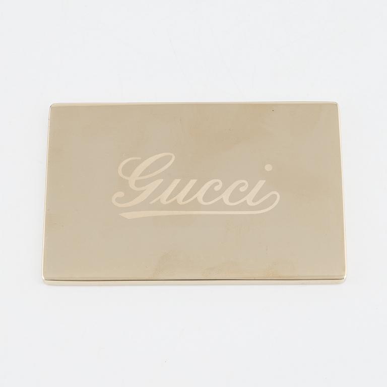 Gucci, a black suede and tan lining bag.