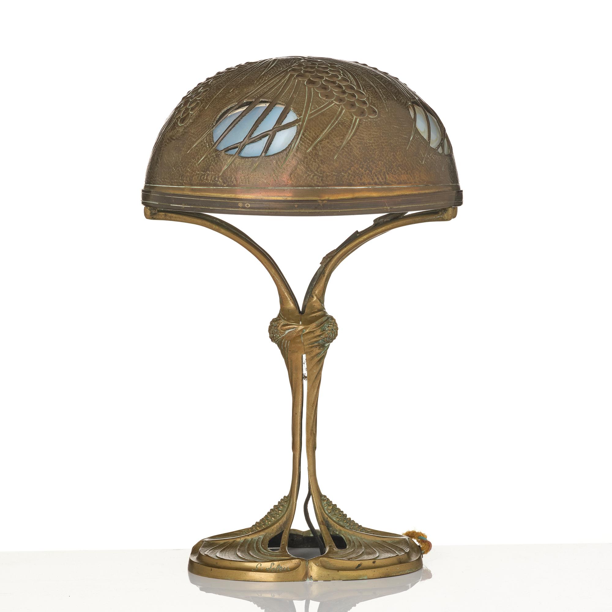 A bronze and brass table lamp, with signature Georges Leleu.