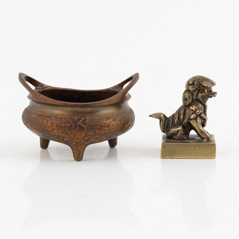 A Chinese bronze seal stamp and a tripod censer, late Qing dynasty, 19th century.