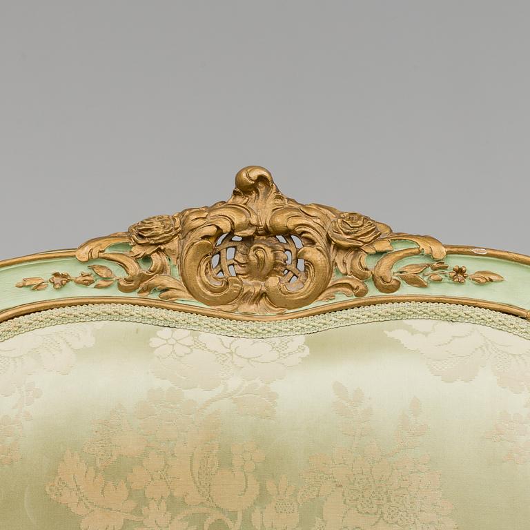 The second half of the 19th century Louis XV-style sofa.