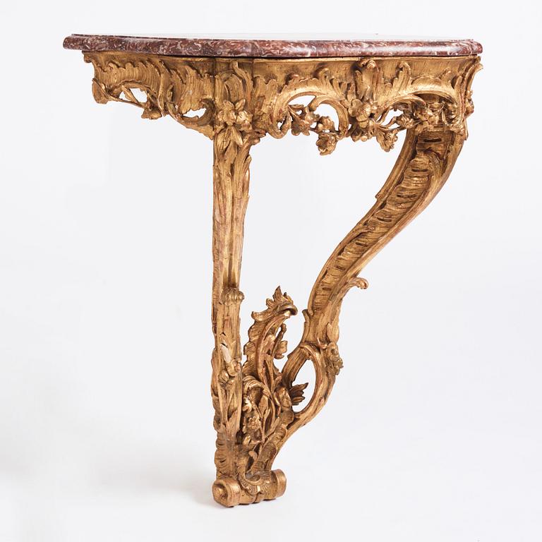 A Central European Louis XV carved and giltwood console table, mid 18th century.