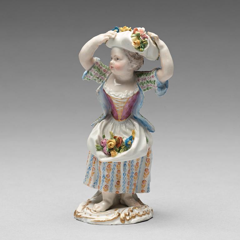 A Meissen figure of a girl with flowers, 1890's.