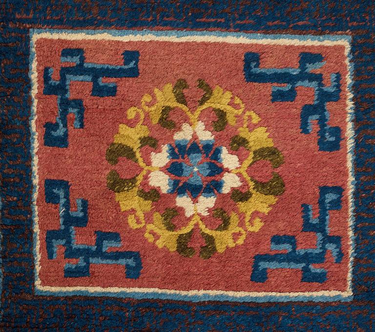 A MEDITATION CARPET, ten squares, a semi-antique Ningxia, China, ca 598,5 x 62 cm.