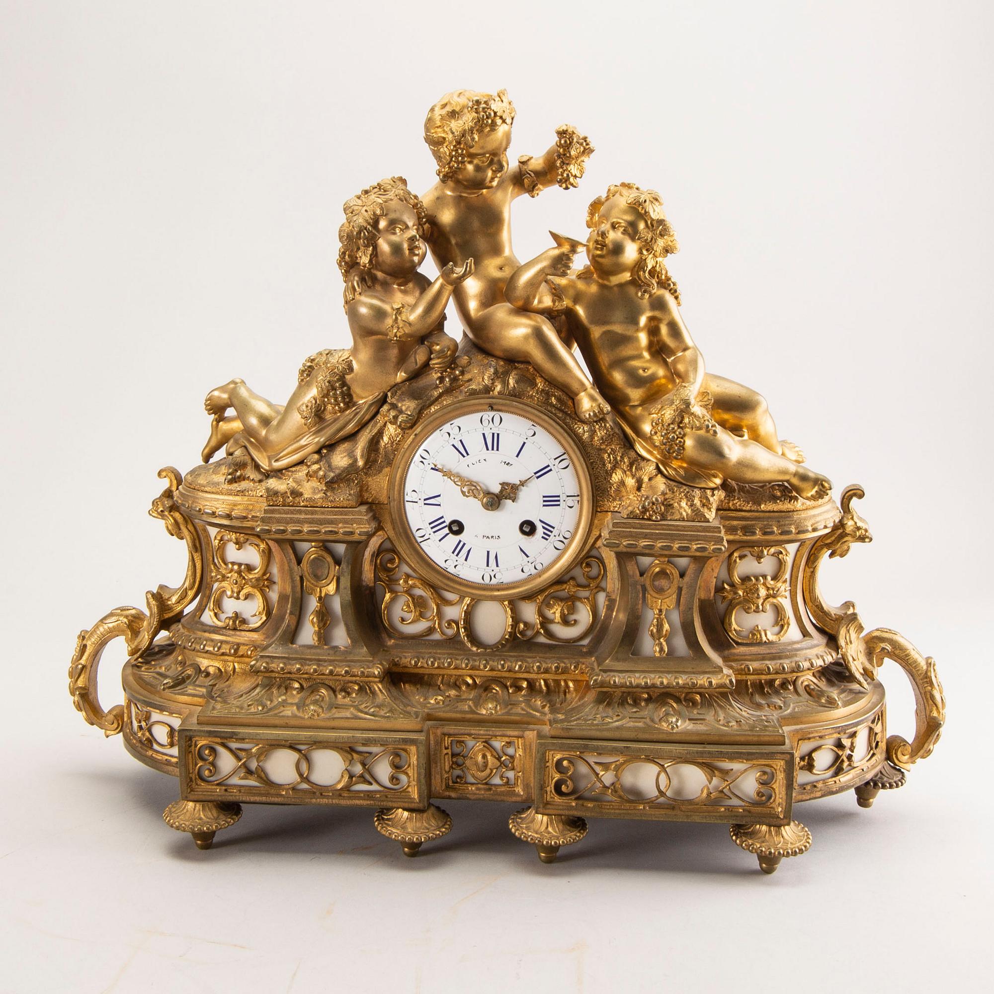 A Louis XV style table clock around 1900.