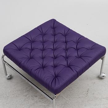 Bruno Mathsson, a limited edition of 'Karin 73' leather upholstered easy chair with footstool, from Dux, Released 2022.
