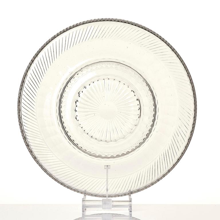 A cut glass punch bowl with cover, stand and ladle, Empire, first part of the 19th century.