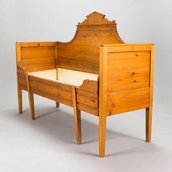 A wooden bed / sofa from around 1900.