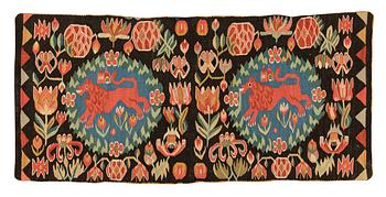 252. A cushion, 'Red Lion' (Rött Lejon), tapestry weave, ca 100 x 47 cm, southwestern Scania, first part of the 19th century.