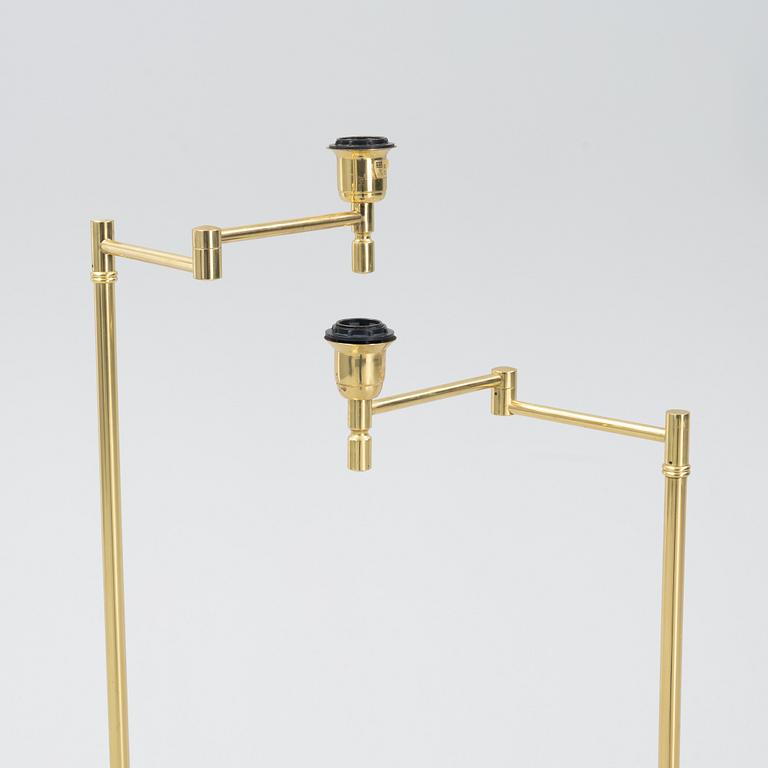 A pair of brass floor lamps, EWÅ, Sweden, second half of the 20th century.