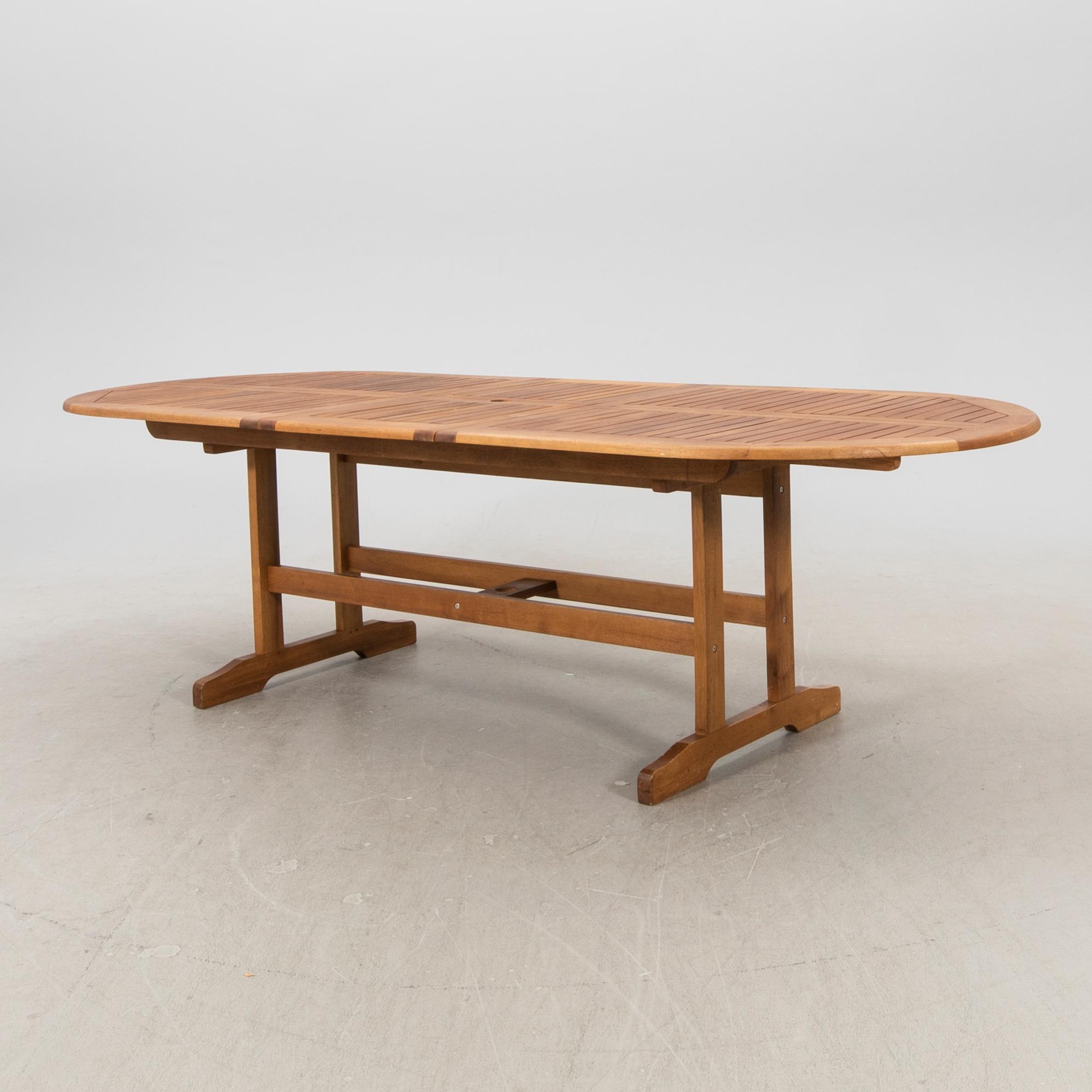 A 9 pcs stained teak garden suite by Brafab around 2000.