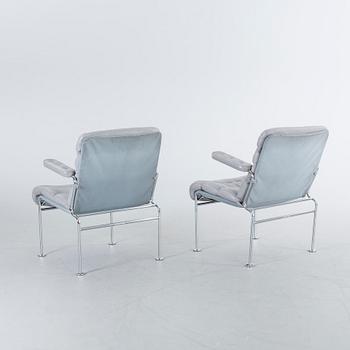 A COUPLE OF BRUNO MATHSSON ARMCHAIRS.
