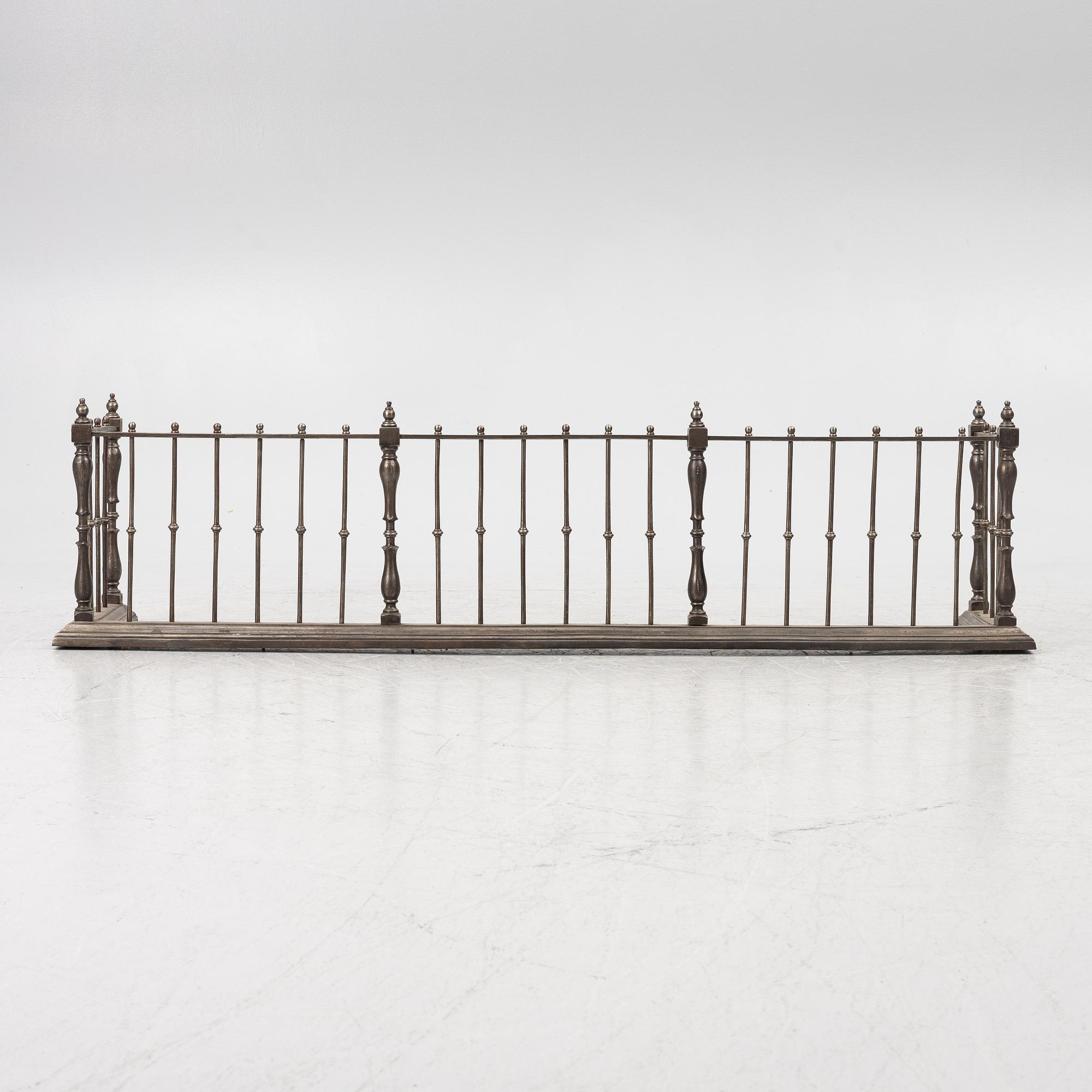 An English brass fire gate, circa 1800.