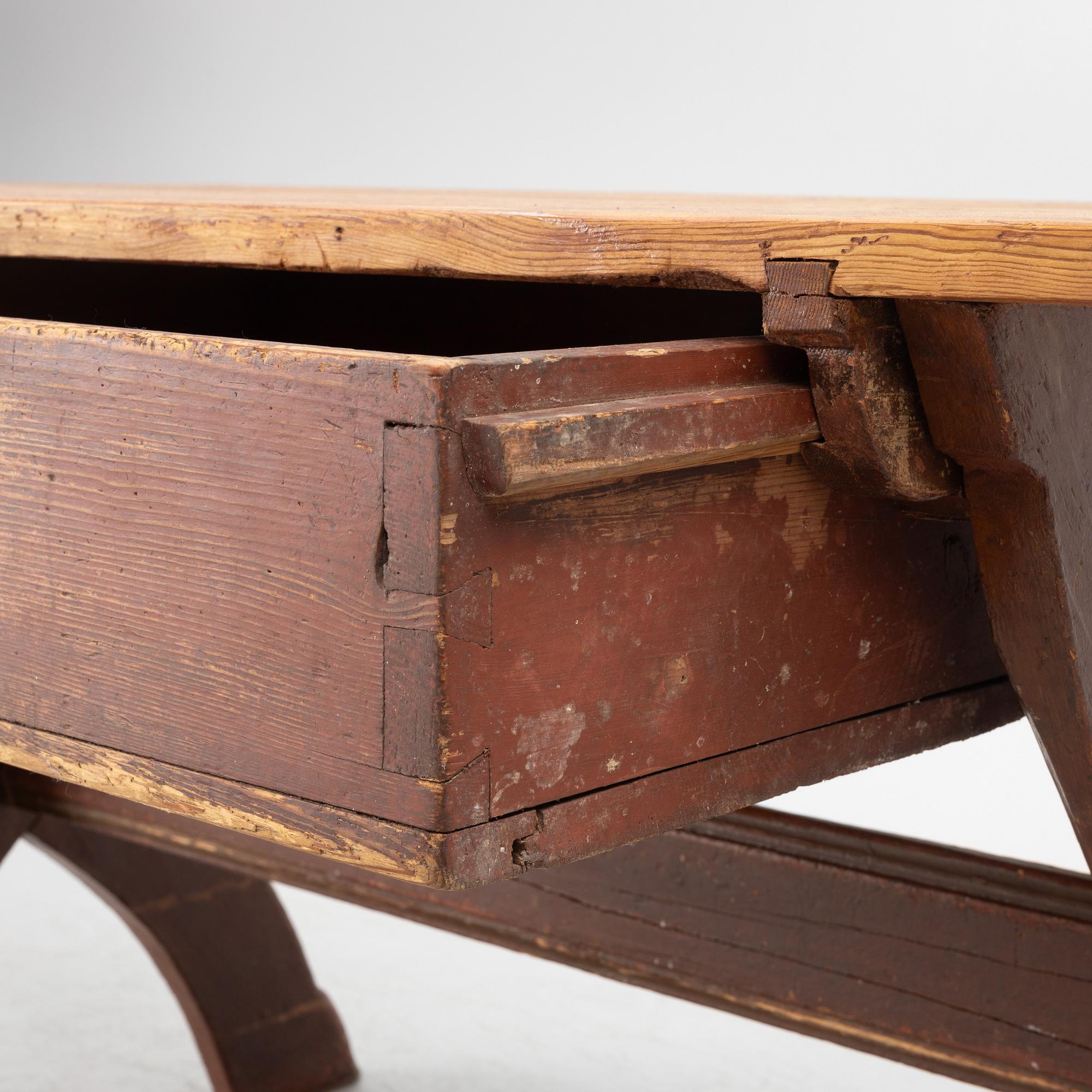 A Swedish folk-art trestle table from Dalarna, dated 1854.