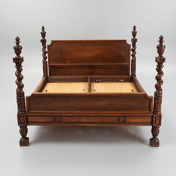 A carved Baroque style bed, early 20th Century.