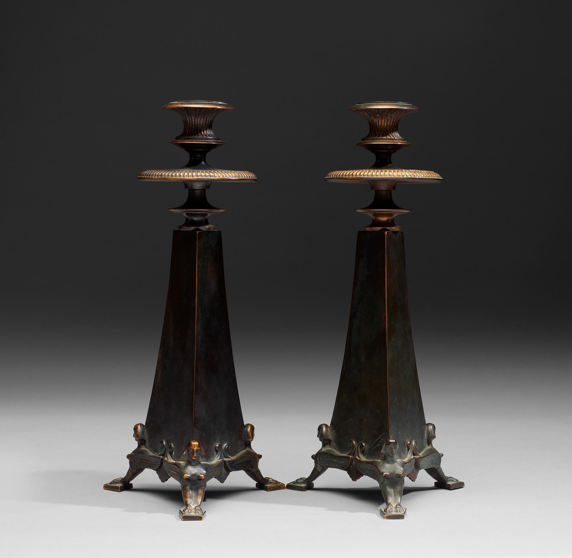 A pair of Melchior Wernstedt bronze candelsticks, foundry Herman Bergman AB.