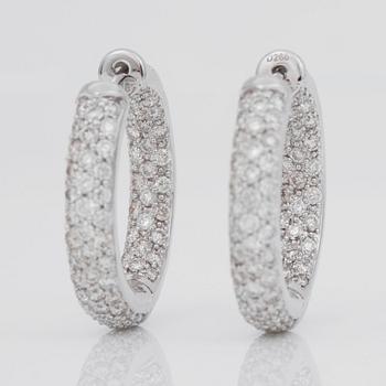 A pair of diamond hoop earrings, 2.66 cts in total.