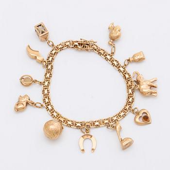 ARMBAND 18K guld berlocker 20,9 g, Stockholm 1958.