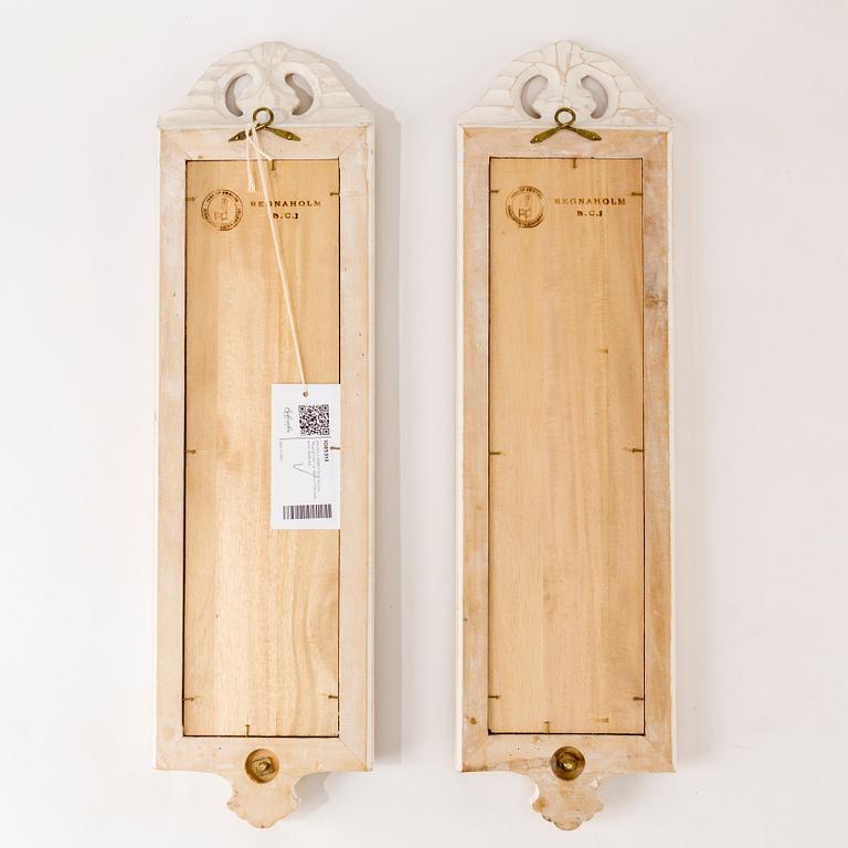 A pair of "Regnaholm" rococo style mirror wall sconces  by IKEA.