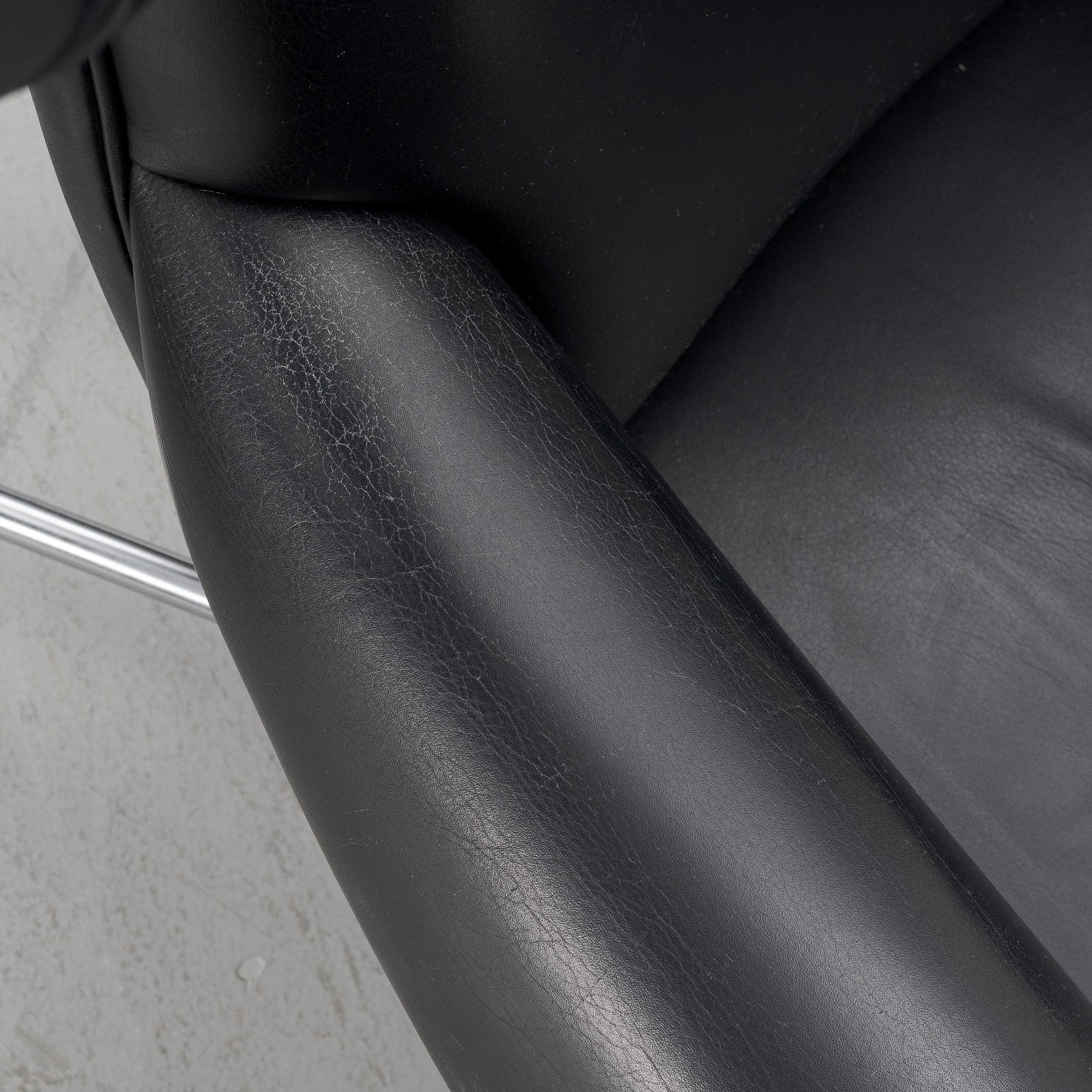 Hans J. Wegner, fåtölj med fotpall, "Ox Chair", EJ-100, Erik Jørgensen Møbelfabrik A/S, Svendborg, Danmark.