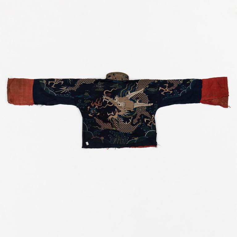 A rare fragment of a silk four clawed 'dragon' jacket, late Ming dynasty/early Qing dynasty.