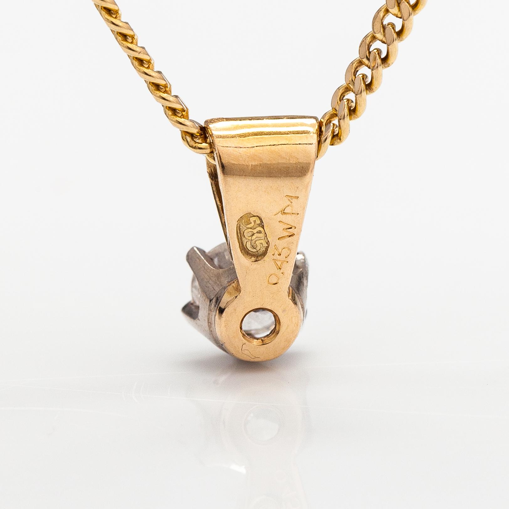 A 14K gold neckalce with a ca. 0.45 ct diamond according to engraving.