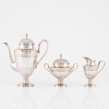 A Swedish Silver Coffee Pot, Creamer and Sugar Bowl, mark of CG Hallberg, Stockholm 1897.