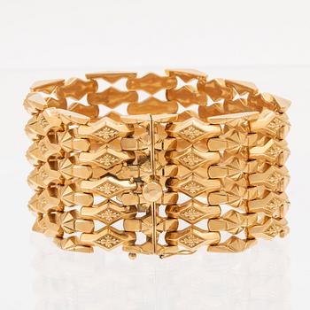An 18C gold bracelet weight 67,6 grams length 19,5 cm.