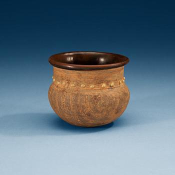 A brown and black glazed rice measurement cup, Song dynasty (960-1279).