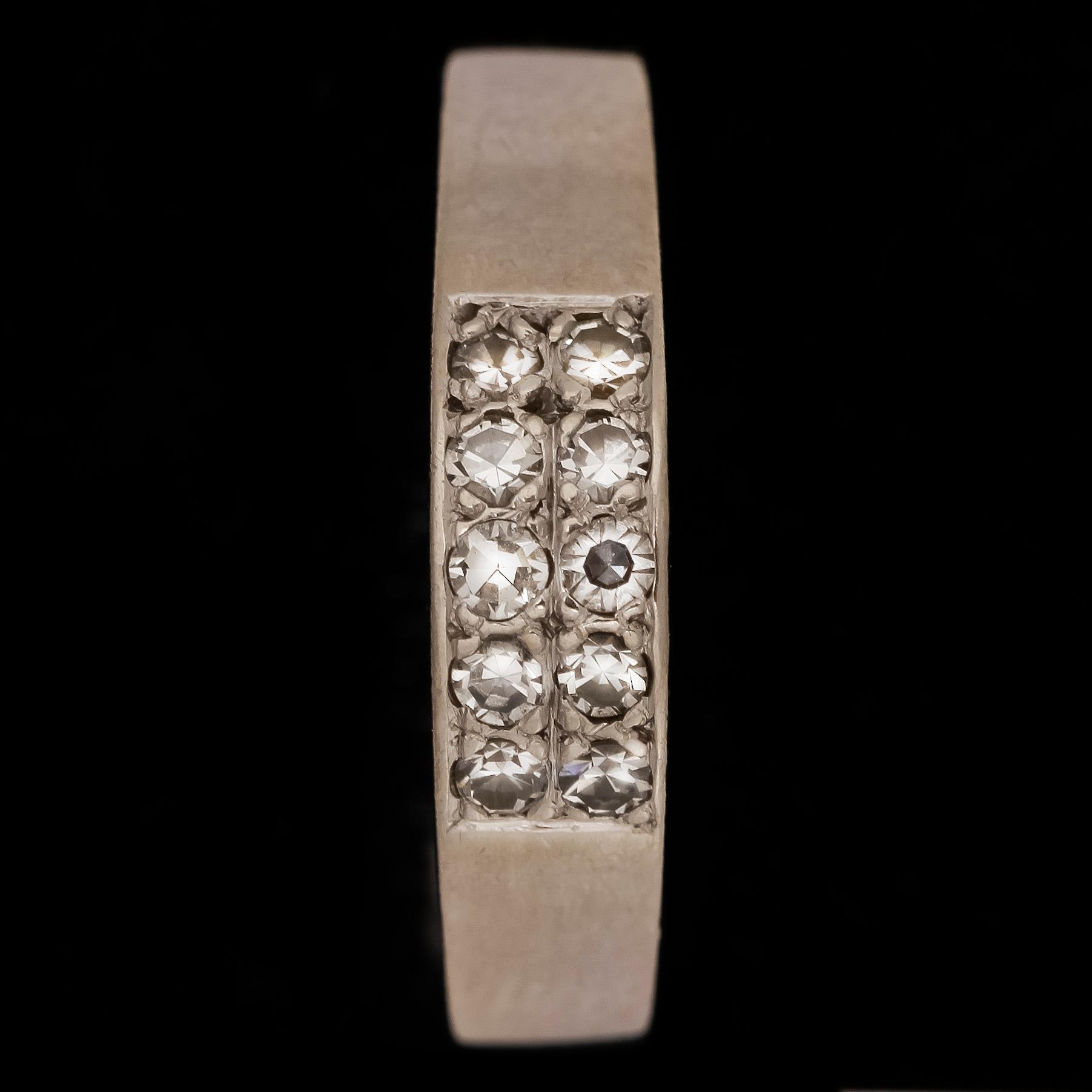 RING, 18k vitguld med åttkantsslipade diamanter tot ca0,20ct. Cedstam, Stockholm, 1981. Vikt 3,4g.