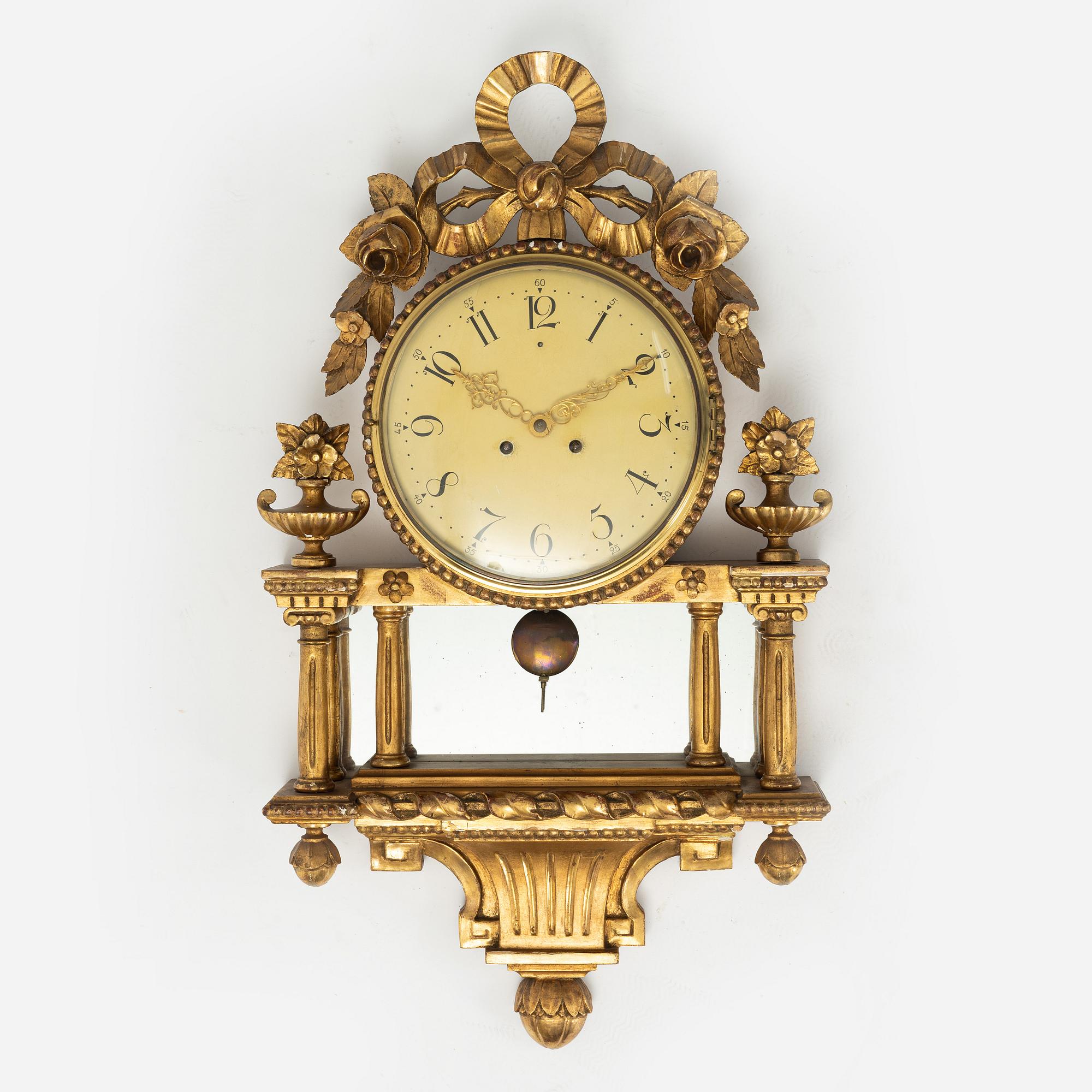A  late Gustavian style wall clock, early 20th century.
