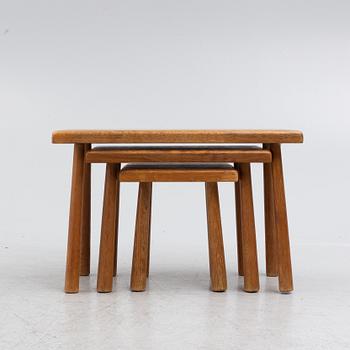 A set of three nesting oak tables or stools. second paert of the 20th century.