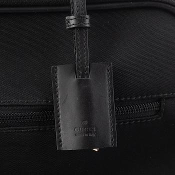 Gucci, suitcase/cabin bag.