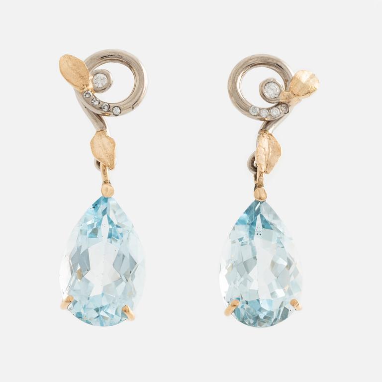 Earrings with pear-shaped topazes and brilliant-cut diamonds.