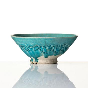 A Kashan Turquoise glazed conical pottery bowl, central Persia, 13th century.