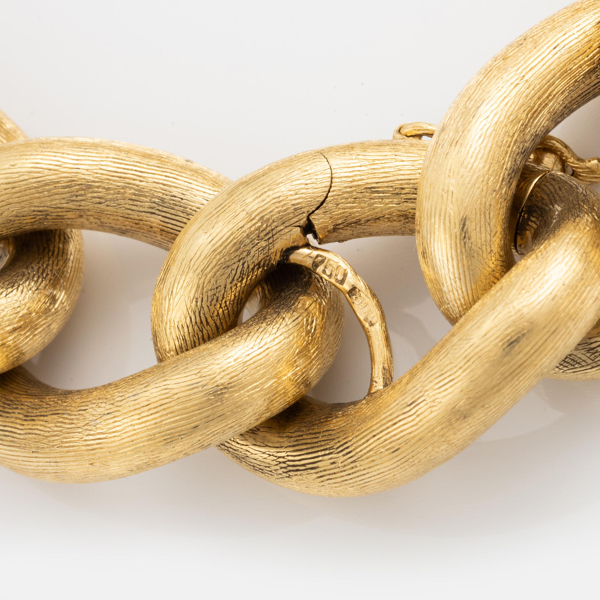 An 18K gold bracelet.