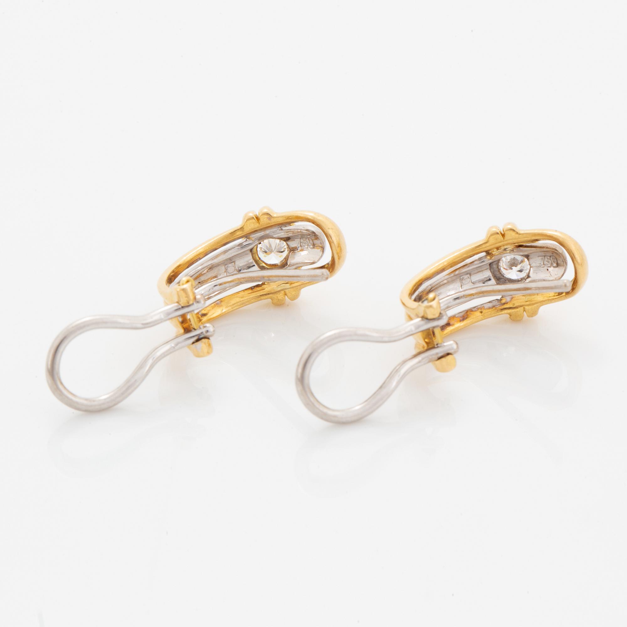 A pair of 18K gold earrings.