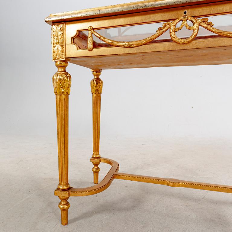 A gilded Louis XVI style display table first half of the 20th century.