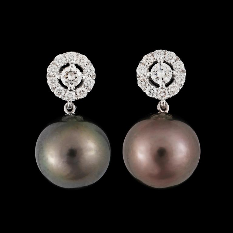 A pair of cultured tahitipearl, 12.6 mm, and diamond, circa 0.70 ct, earrings.