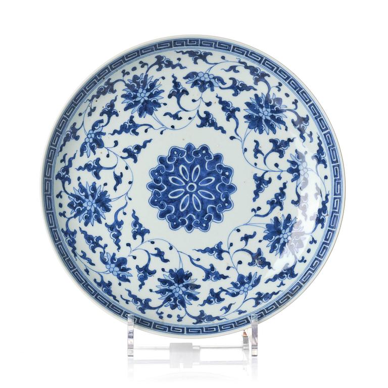 A blue and white lotus dish, Qing dynasty with a Qianlong mark and of the period (1736-95).