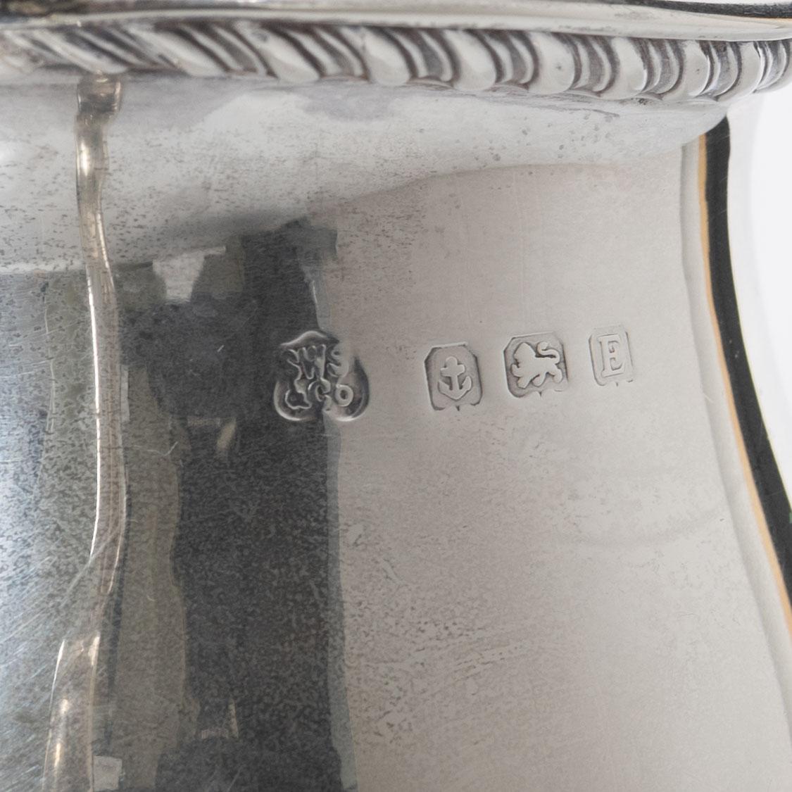 A silver cream jug, mark of S W Smith & Co, Birmingham, England 1929.