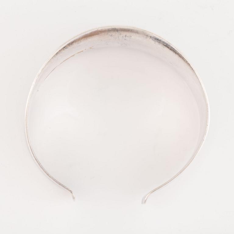 A silver and amethyst bracelet.