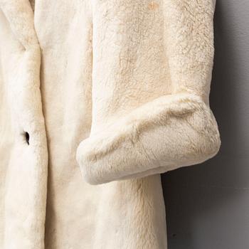 YVES SAINT LAURENT, a fur coat, size ca medium.