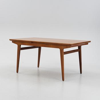 A 1960s teak veneer dining table.