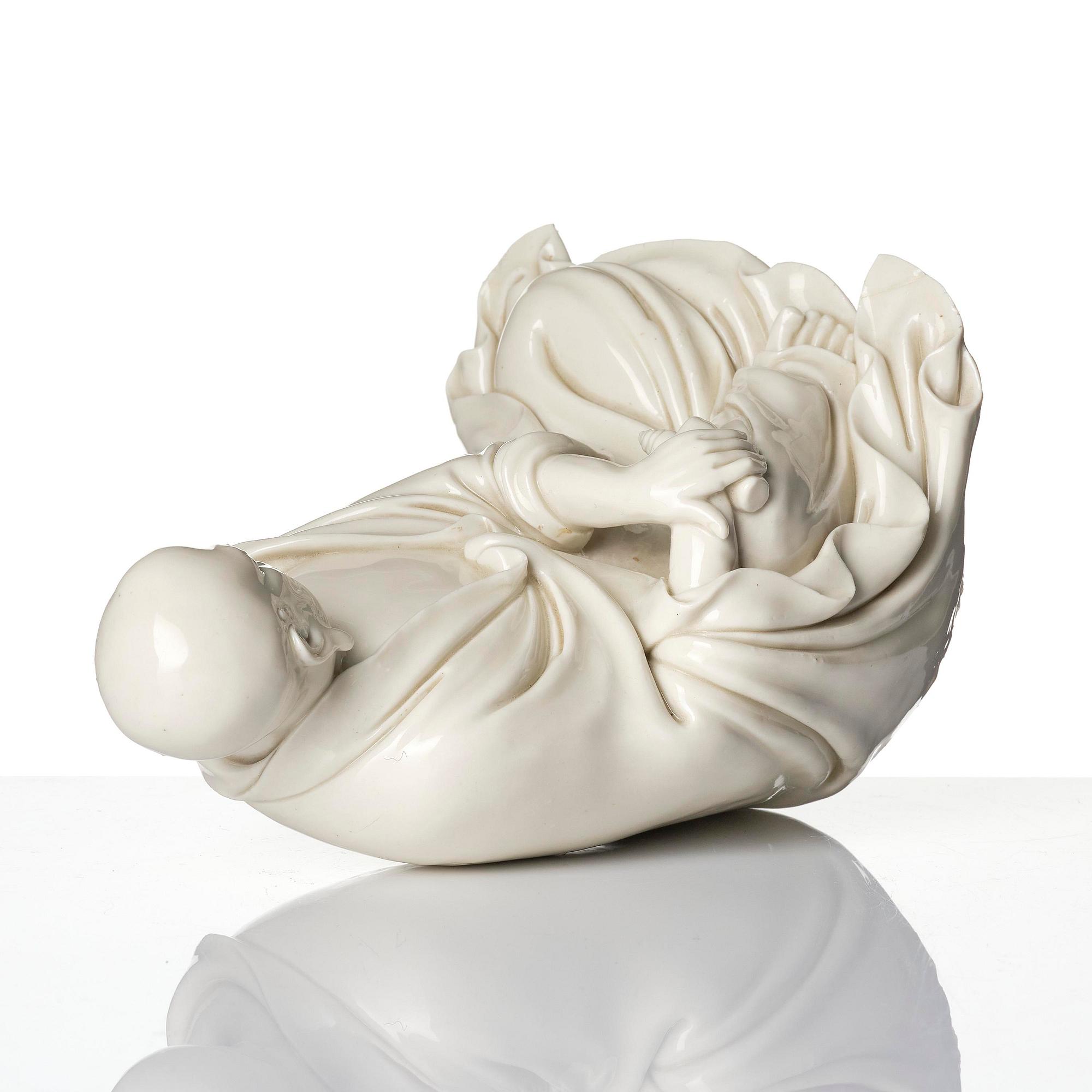 A blanc de Chine seated figure of Bodhidharma, Qing dynasty.