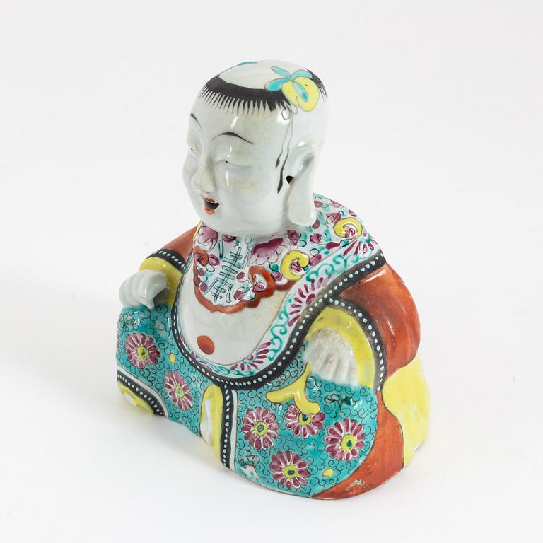 A Chinese porcelain figure of buddai, 20th Century.