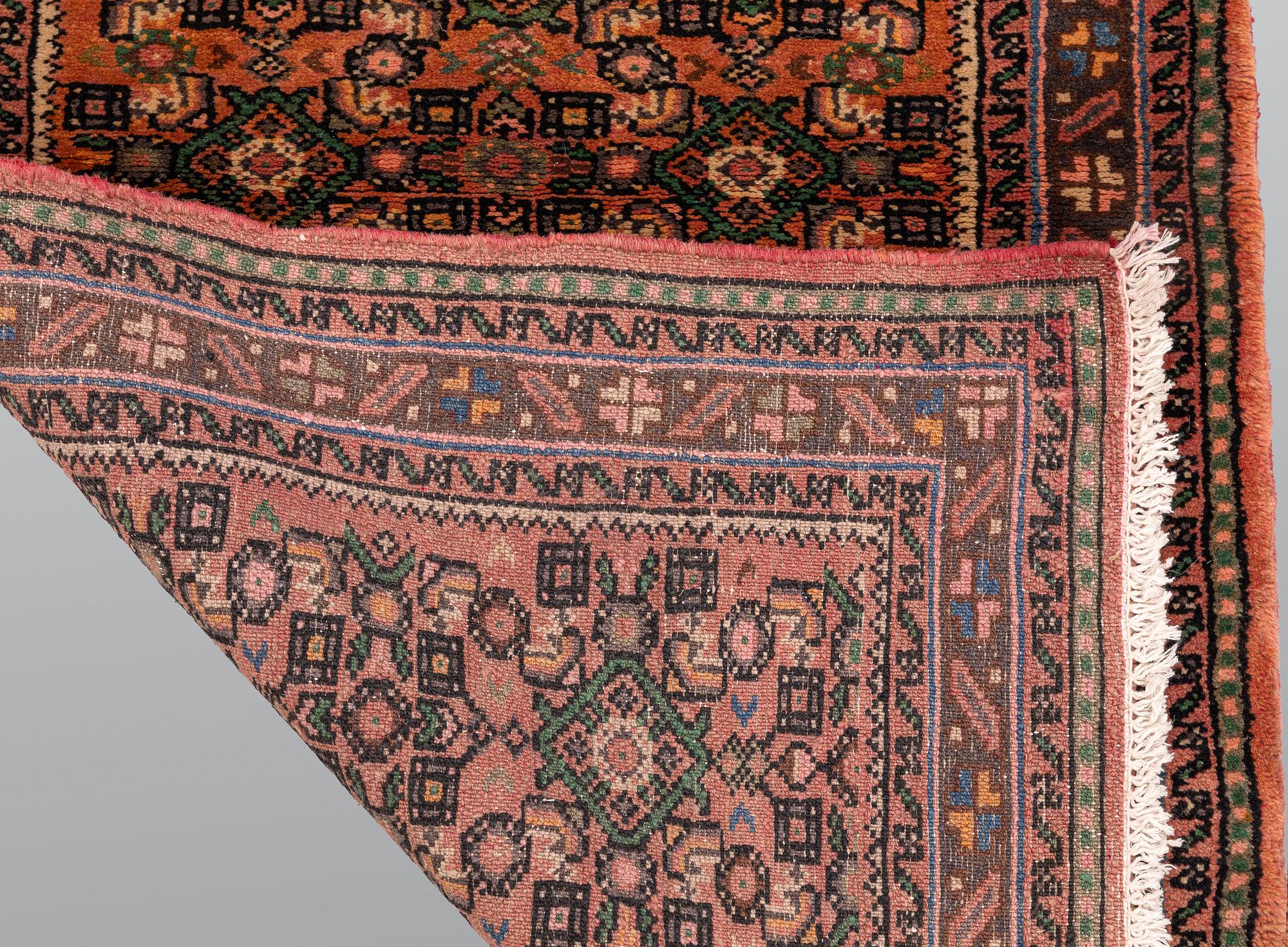 A Hosseinabad runner, approx. 397 x 84 cm.