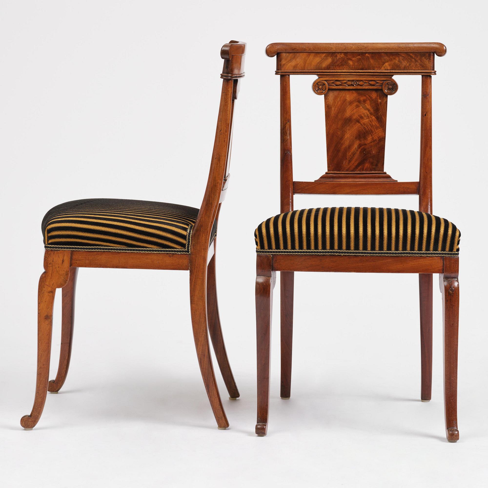A set of nine Charles X mahogny dining chairs.
