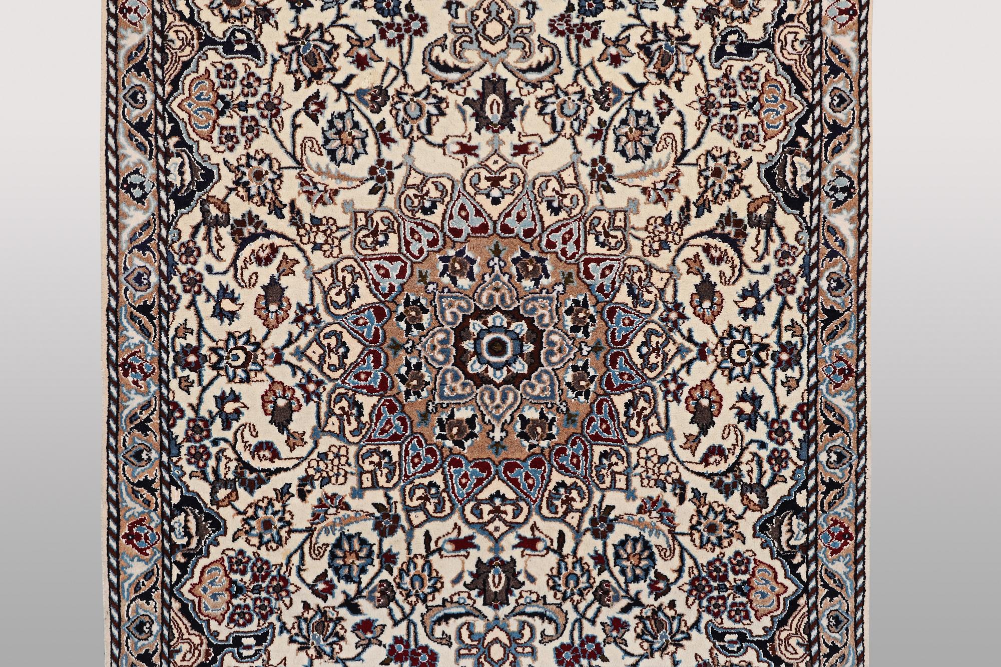 A rug, Nain, part silk, ca 196 x 120 cm.